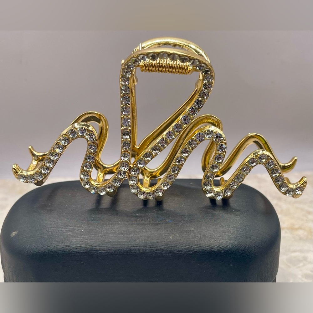 Gold Tone Metal Ribbon Hair Clip with Clear Rhinestone Embellishment